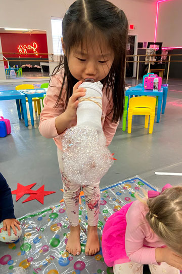 science experiment with bubbles at preschool